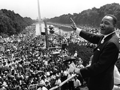 (FILES): This August 28, 1963 file photo shows US civil rights leader Martin Luther King (C) waving from the steps of the Lincoln Memorial to supporters on the Mall in Washington, DC, during the "March on Washington". US President Barack Obama will mark the 50th anniversary of Martin Luther King's "I have a dream" speech by speaking from the same steps at the Lincoln Memorial in Washington. The August 28 event in the US capital will take place on the exact spot where King delivered his famous address on the same day in 1963. Obama, the first black US president, will speak about the half century that has passed since the "March on Washington for Jobs and Freedom," which culminated with remarks by the Atlanta pastor and civil rights icon. In 1963 King spoke in front of 250,000 people, explaining his wish for better relations between black and white Americans. His words were engraved on the steps of the monument where he spoke. AFP PHOTO / Files-/AFP/Getty Images